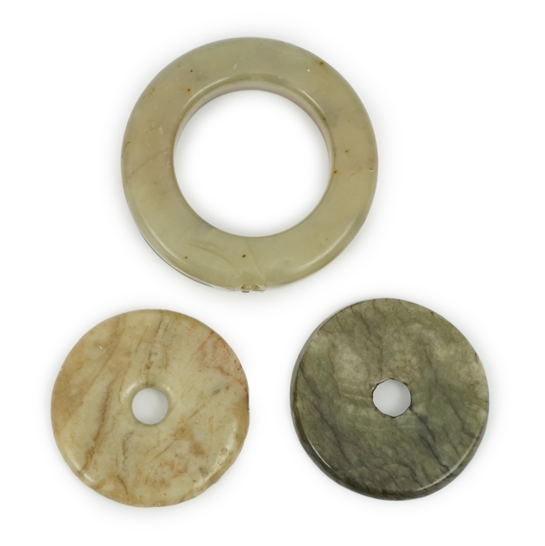 Two Chinese soapstone bi discs, and a jade ring, 18th century or earlier, largest 6.5cm in diameter. Condition - good